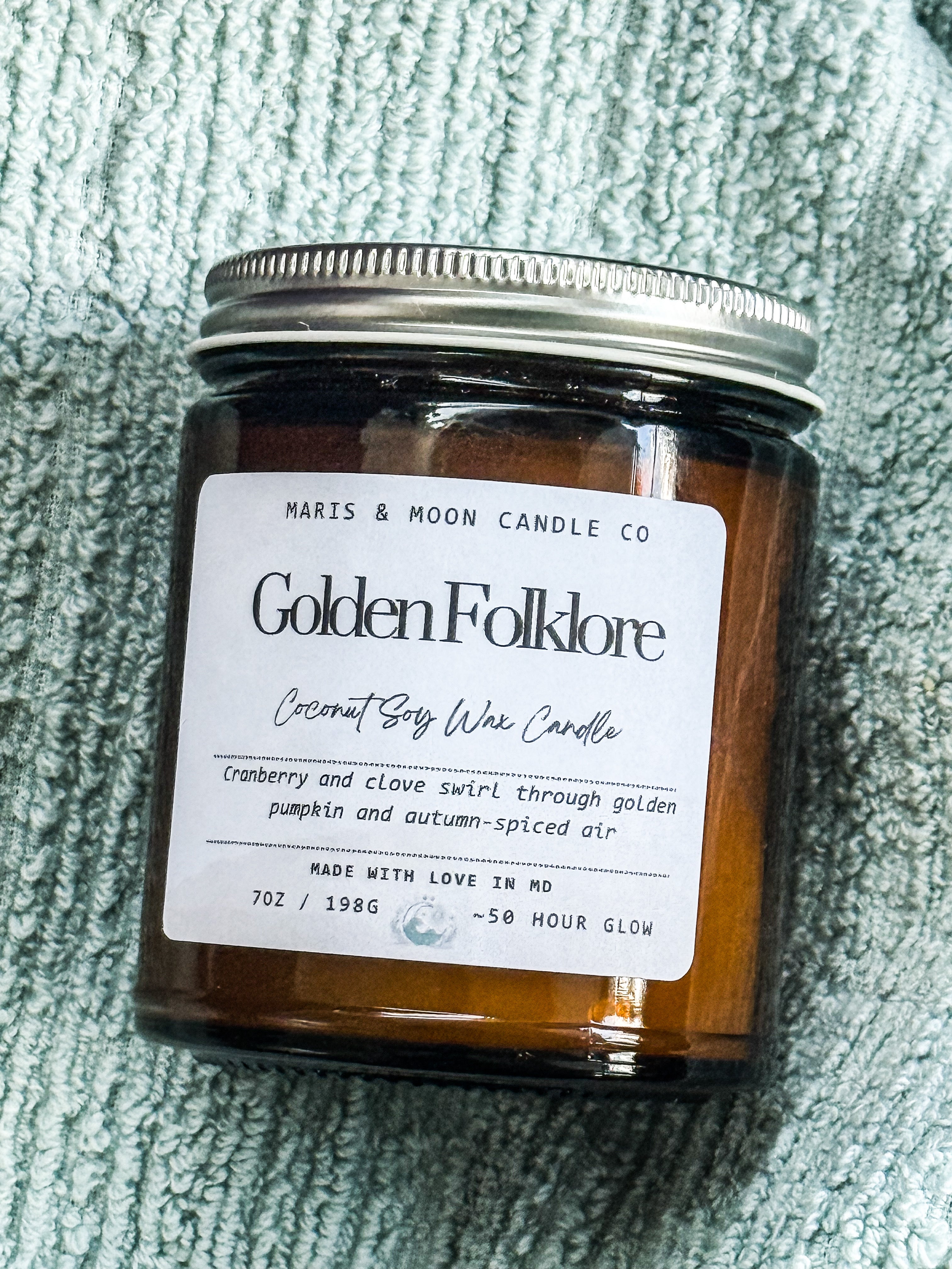 Golden Folklore 7oz amber glass candle with crystal