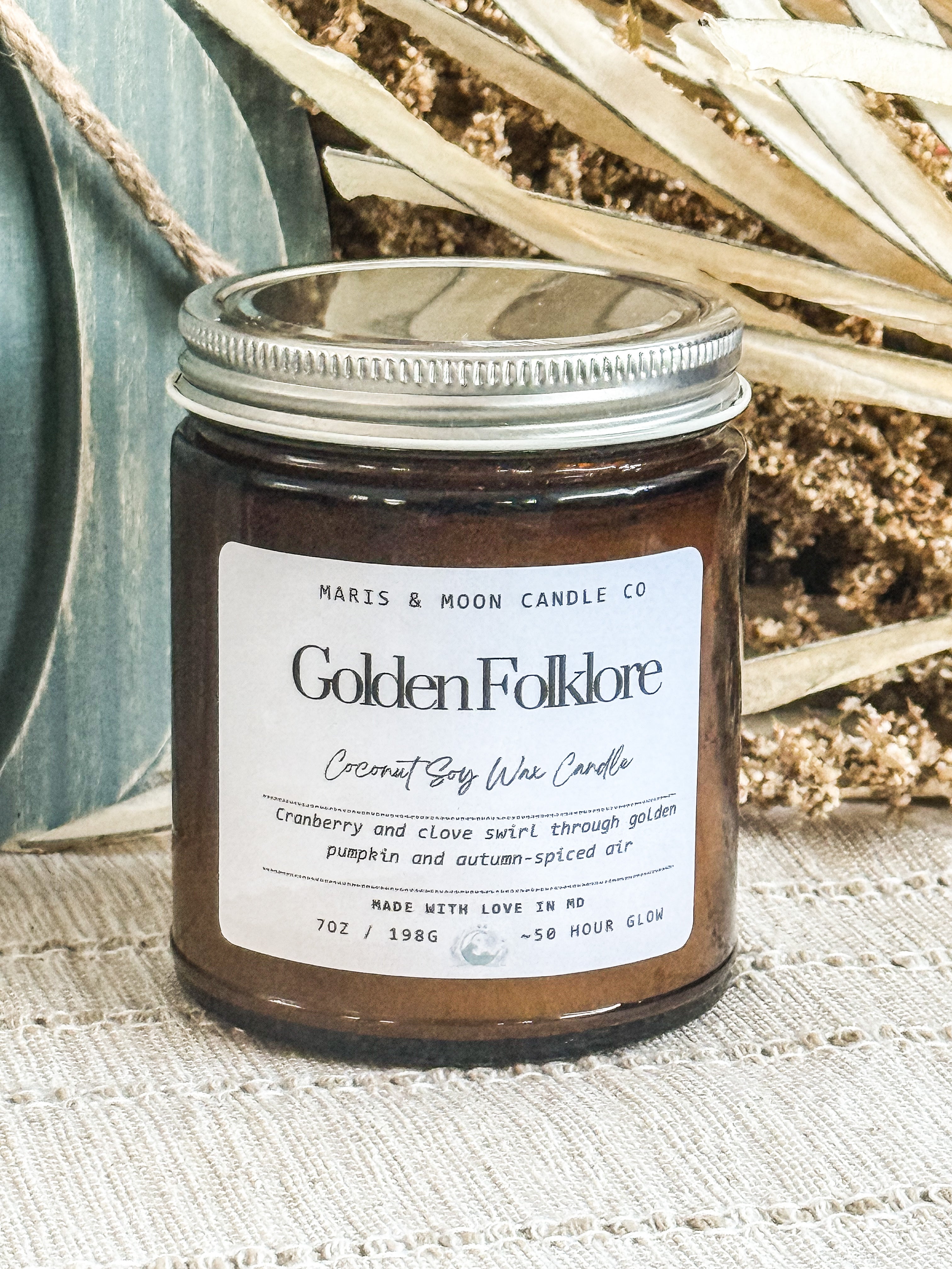 Golden Folklore 7oz amber glass candle with crystal