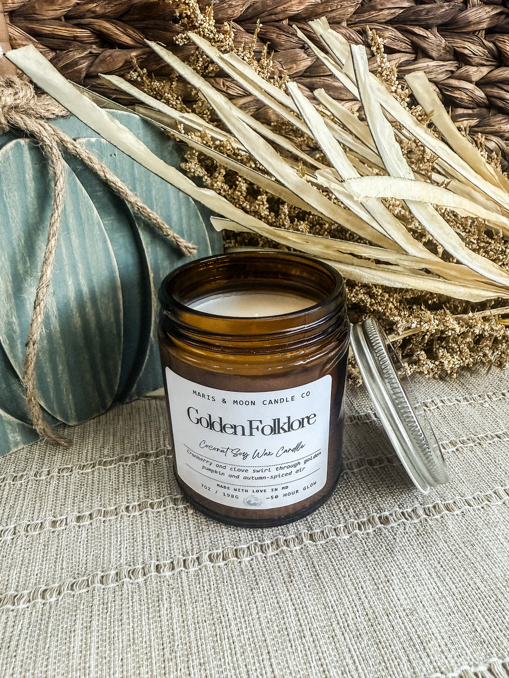 Golden Folklore 7oz amber glass candle with crystal