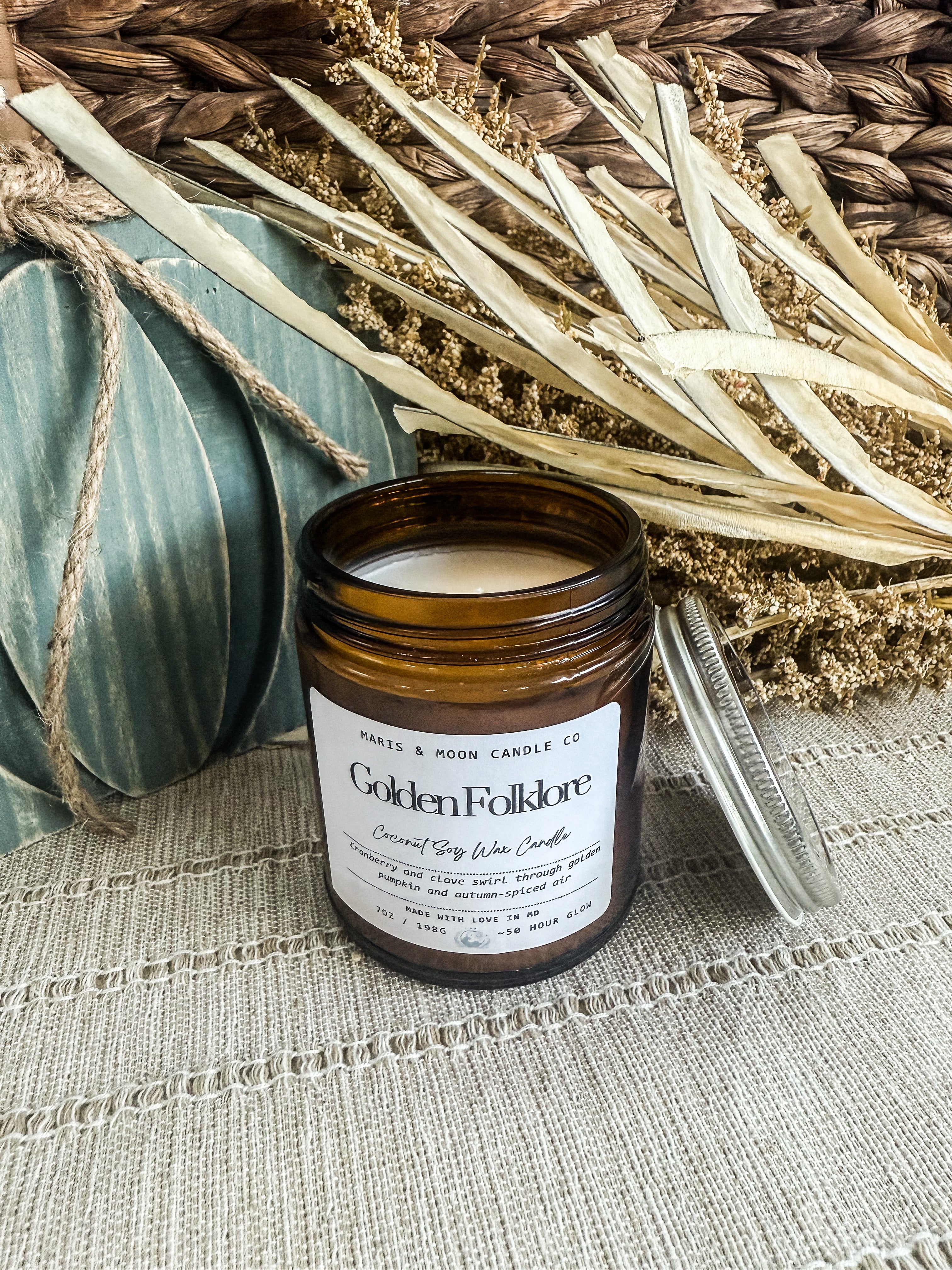 Golden Folklore 7oz amber glass candle with crystal