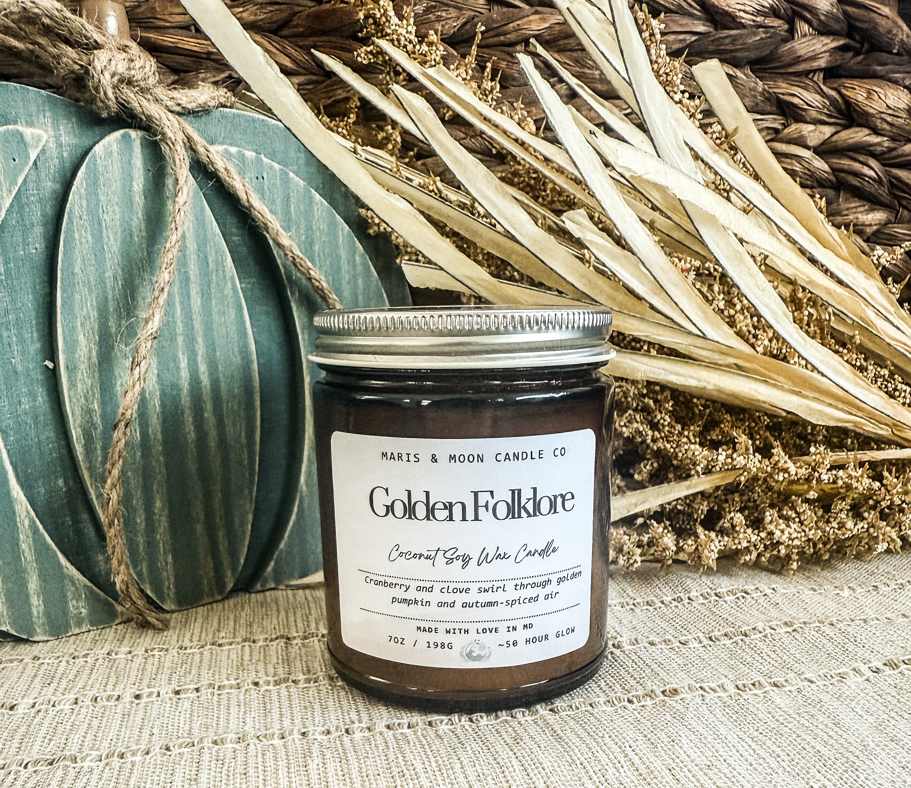 Golden Folklore 7oz amber glass candle with crystal